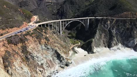 Aerial-forward-view,-Big-Sur-and-Bixby-Bridge,-over-Ocean