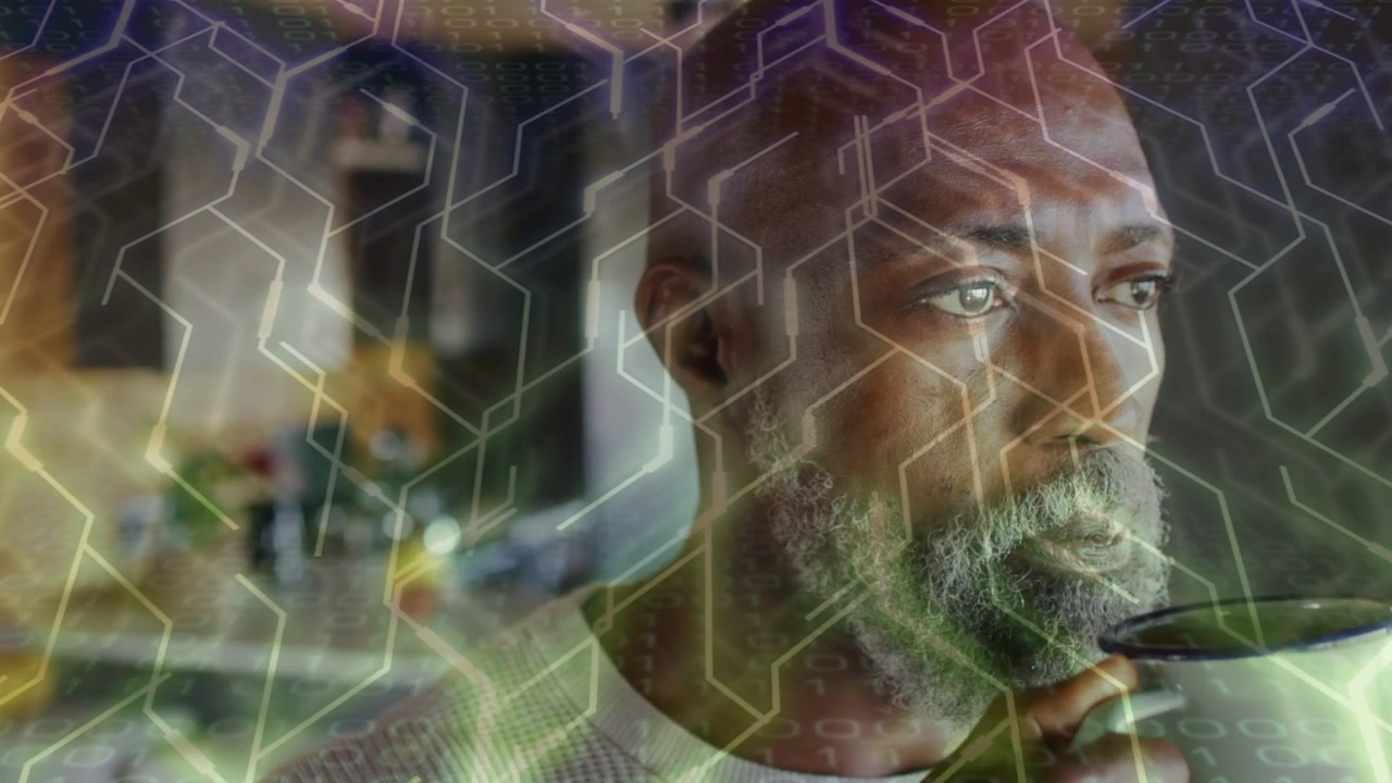 Man lifting mug, sipping and lowering cup, tech hex overlay accenting beard, pausing in thought