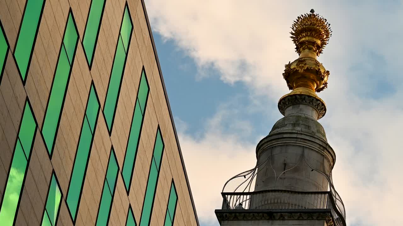 Modern Building and Golden Monument