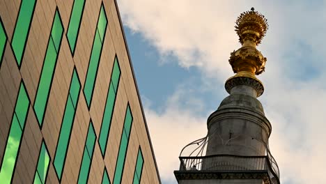 modern building and golden monument