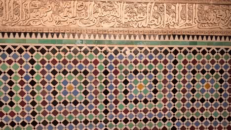 a beautifully crafted mosaic adorns the wall in morocco - pan up shot