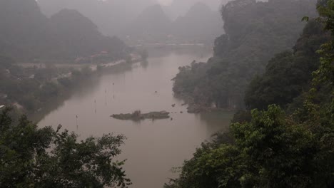 viewpoint overlooking river and layers of mountains through the mist in the mountainous region of ninh ninh in northern vietnam