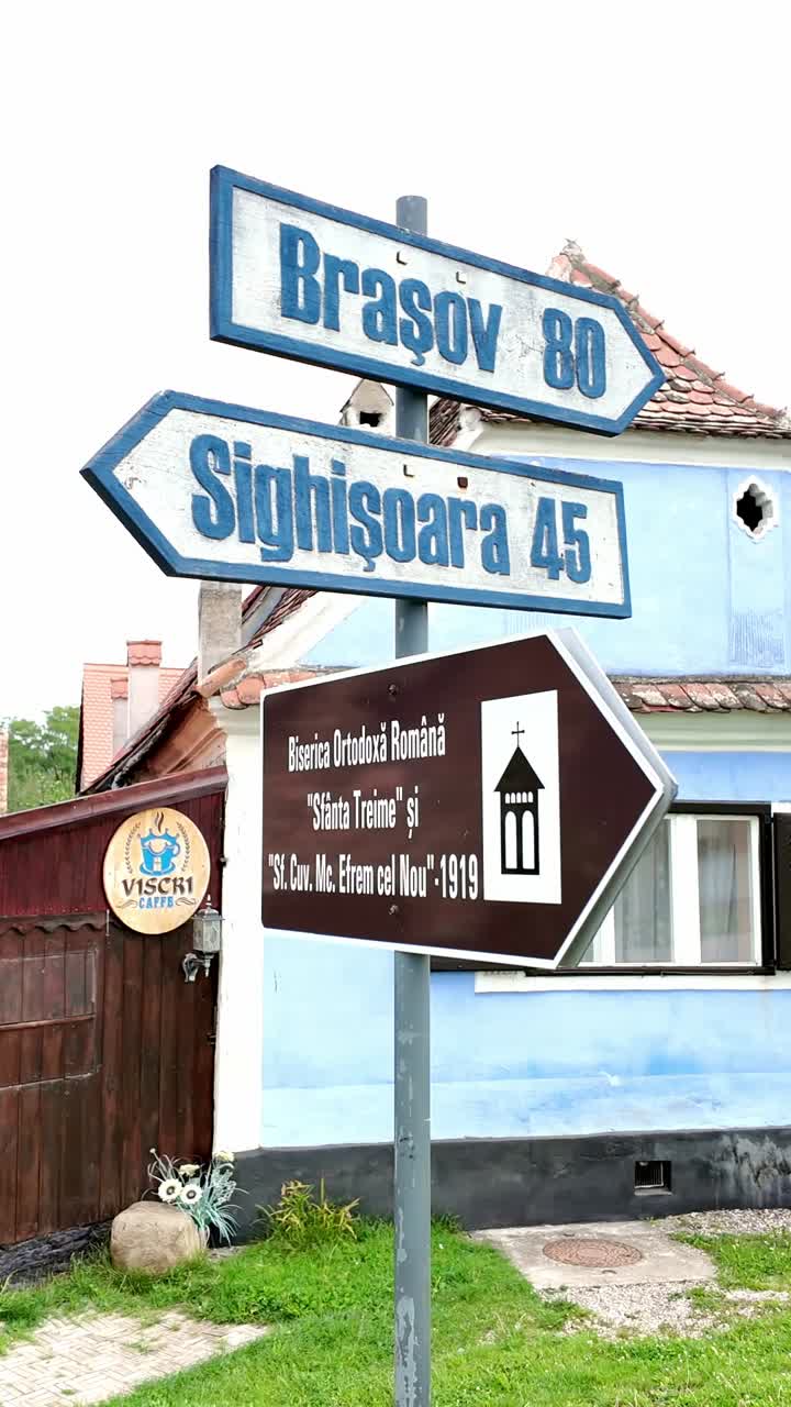 Village road junction direction signpost leads to nearby towns Romania