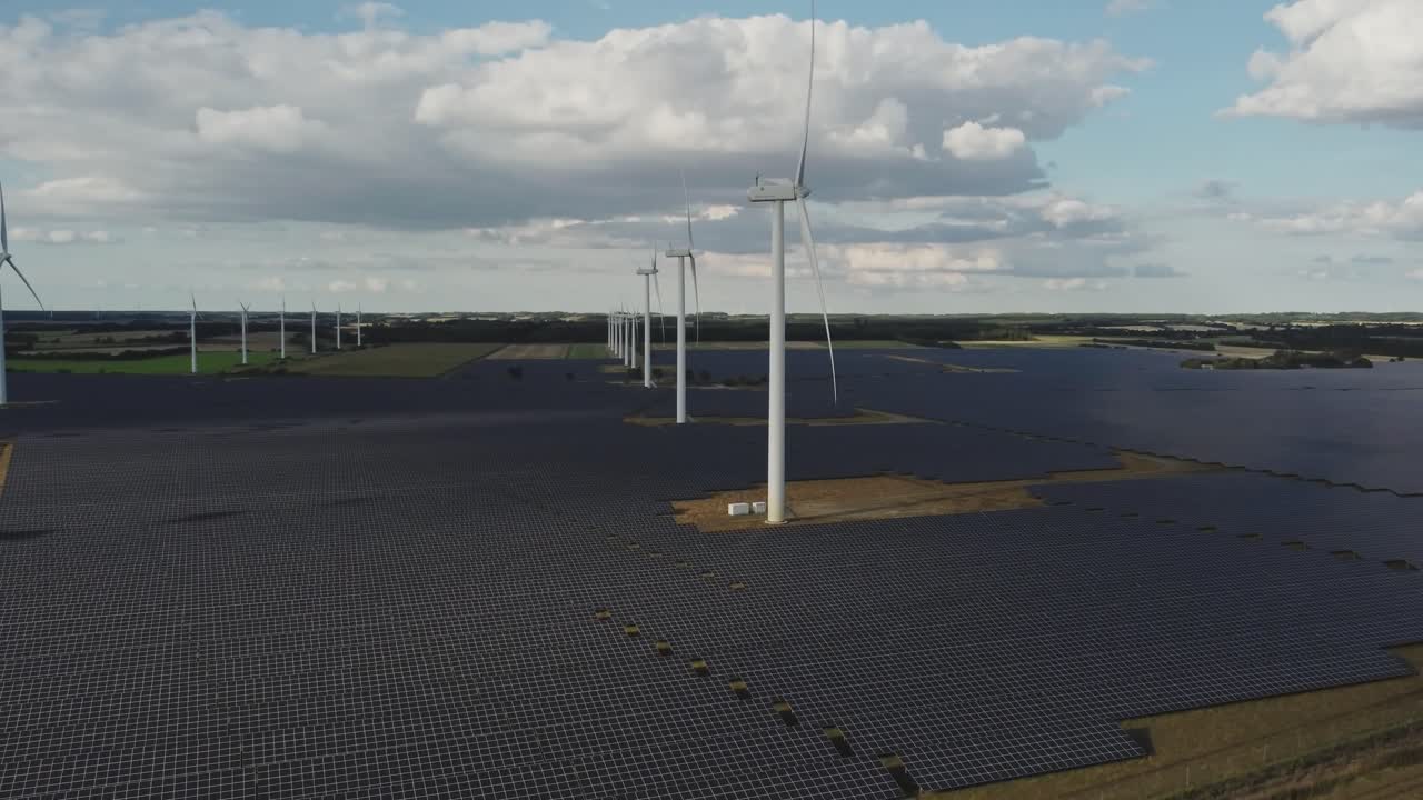 Solar Panels And Wind Turbines Generating Electricity At Sustainable Power Station In Vemb, Denmark
