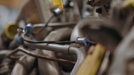 rack focus and slider along an airplane engine being built