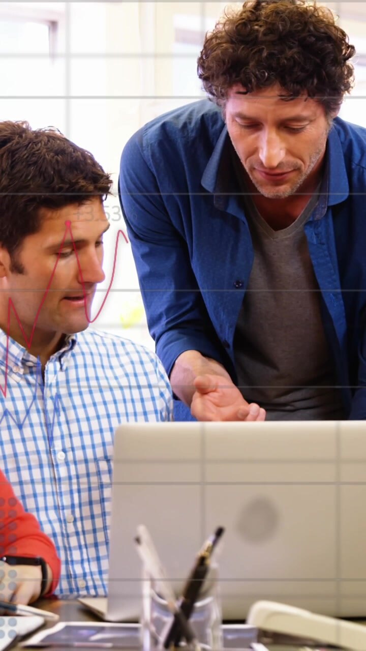 Animation of statistical data processing against diverse colleagues discussing over laptop at office