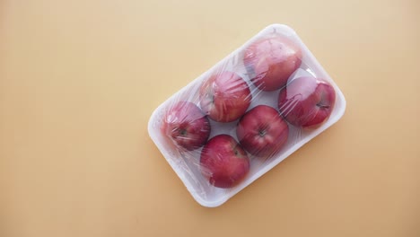 close up of red apples in a package