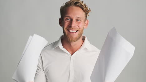 cheerful man holding papers