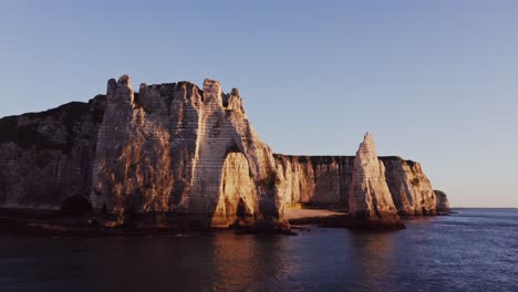 stunning cliffs of etretat at sunrise/sunset