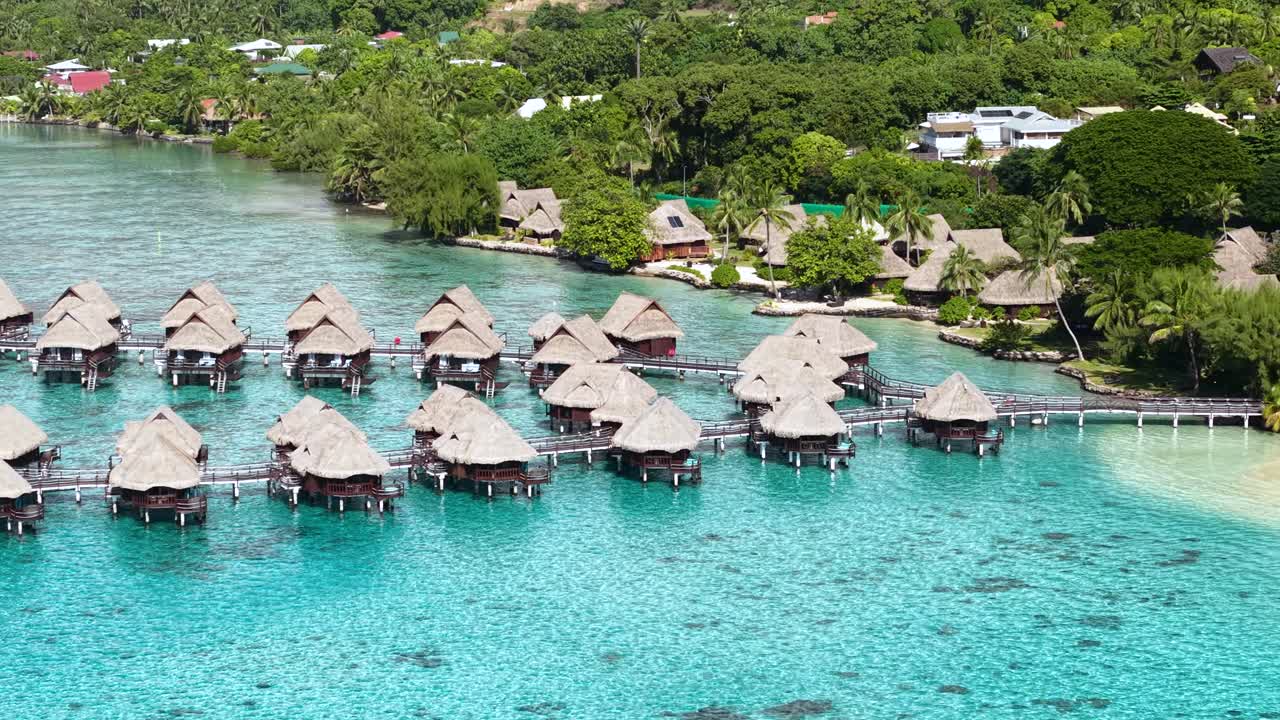 Moorea Island, French Polynesia. Drone Shot of Overwater Bungalows of Luxury Beachfront Resort
