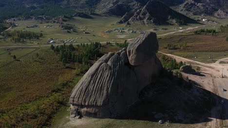 Aerial-circling-view-of-Gorkhi-Terelj's-sacred-rock-in-Mongolia,-also-called-Turtle-Rock