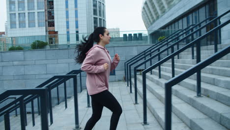 fit girl jogging upstairs