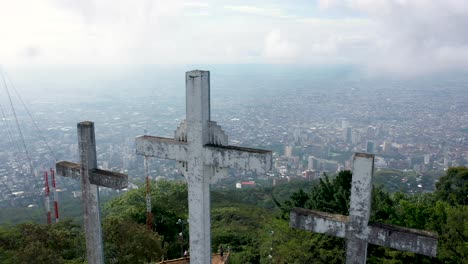 aerial shot over three crosses monument toward the city of cali-colombia