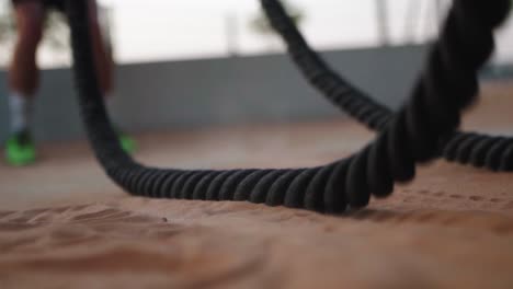 close up of ropes in sand