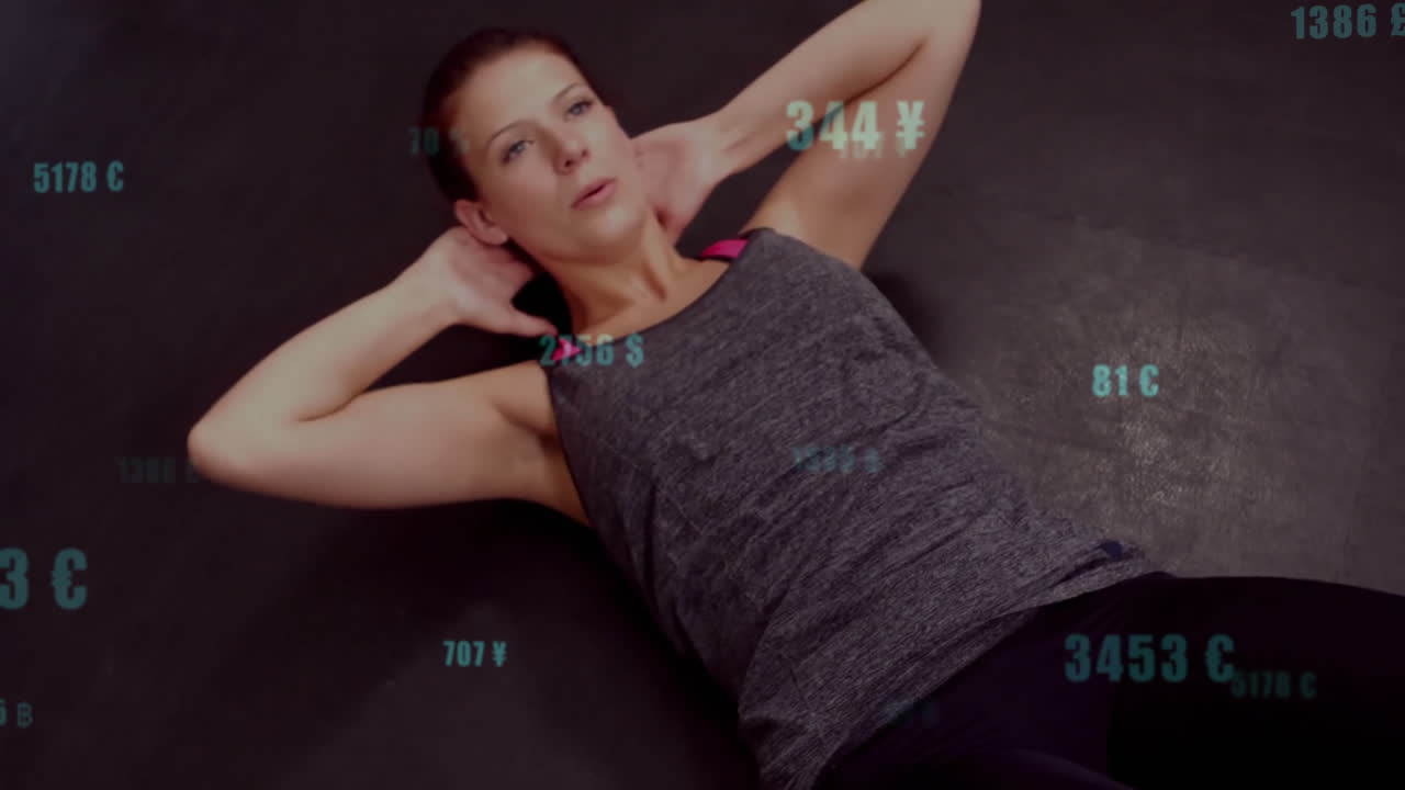 female athlete crunching on dark fitness mat, tracking turquoise numeric and currency metrics