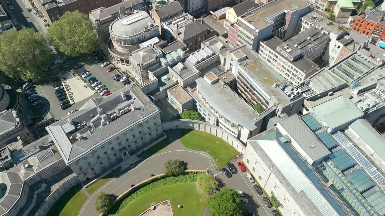 Side-on, overhead aerial video of the grounds at Seanad Éireann in Dublin City Centre, Ireland on a sunny day. Filmed in 4K, 60FPS with Rec709 Color.