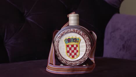 brandy bottle with croatian national symbols, handheld shoot