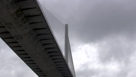 view while travelling under a bridge along the panama canal, ending with view of the shoreline.