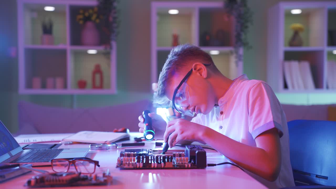 Little boy who is interested in technology.