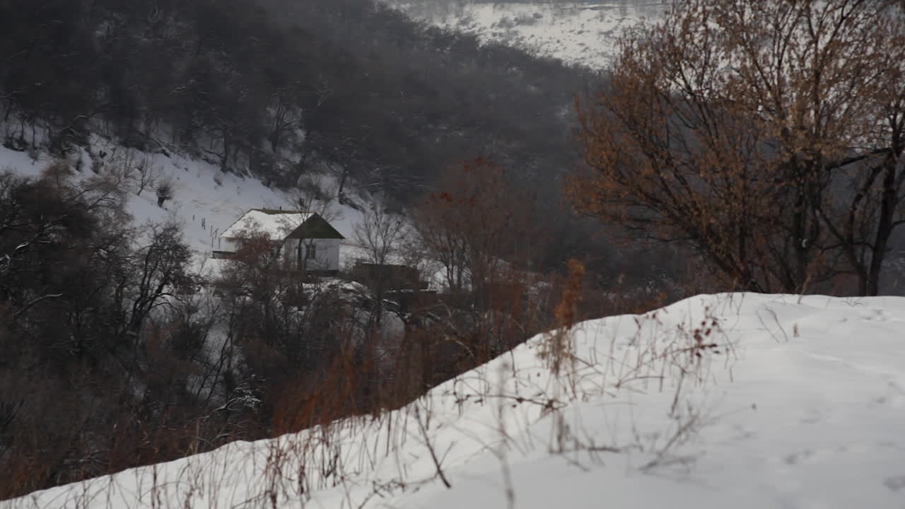 Cabin in the snowy woods, Kazakhstan