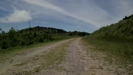 Low-angle-view-of-dirt-track-stone-road-route,-Yungas-way