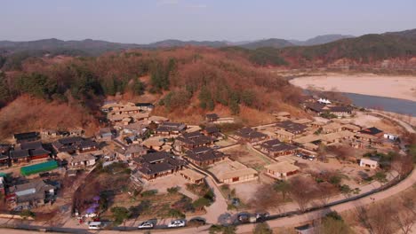 fly in towards traditional korean village