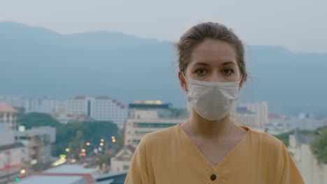 woman wearing mask in cityscape