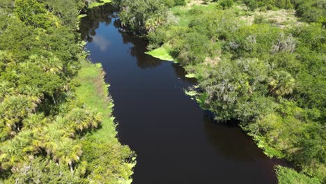 Flying-North-away-from-Alligator-Bridge,-over-Myakka-River-State-Park