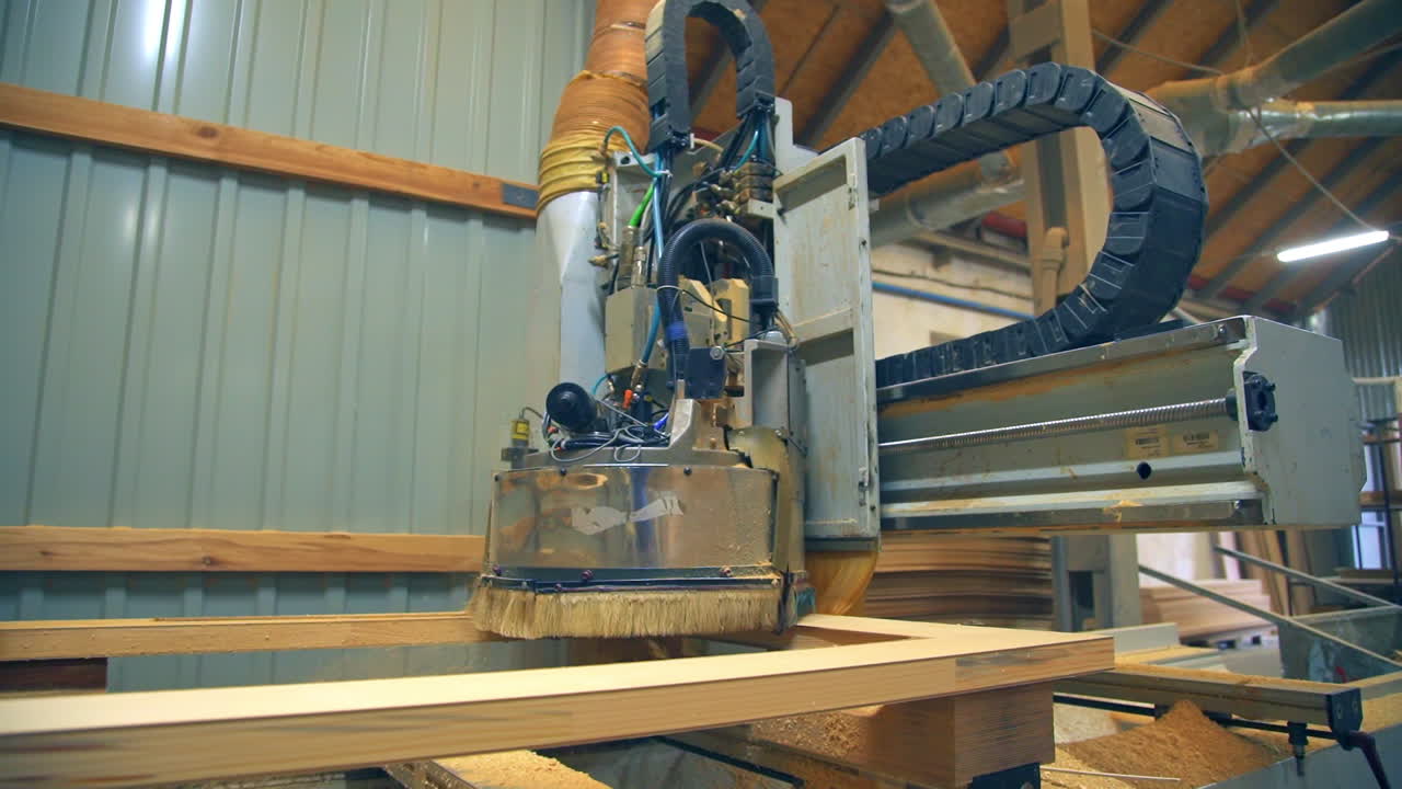 Equipment moves over the door billet, shavings fly aside. Machine-tool working on the present-day plant.