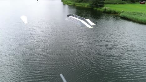 drone shot of jumps in a waterboard watersport park