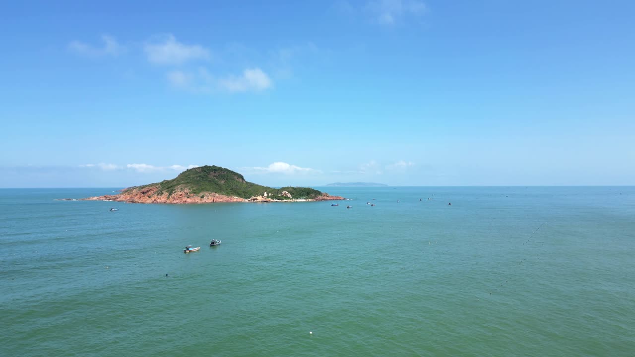 Beautiful vibrant ocean with islands and fishing boats, drone view