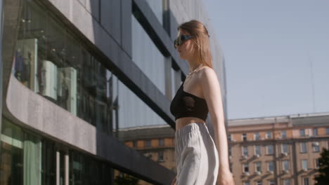 young fashionable woman walking down the street