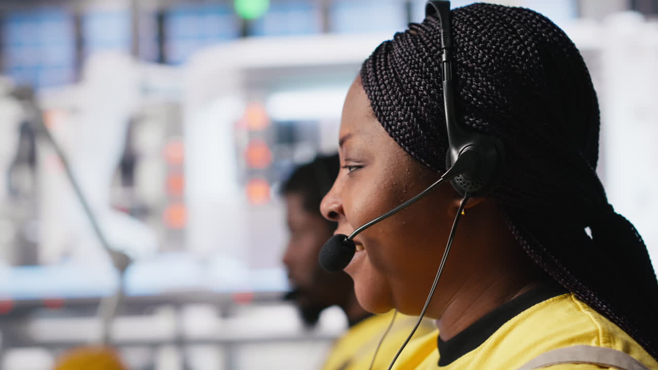 Vertical Video Customer support black engineer at help desk in photovoltaic facility