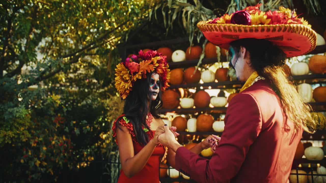 Couple Dancing in Day of the Dead Costumes