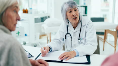 asian woman, doctor and talking to couple