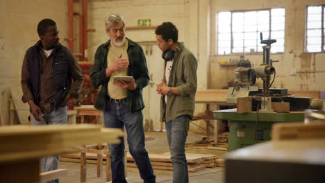 woodworking workshop with men talking