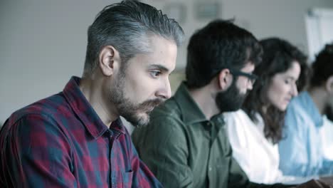 closeup shot of focused developer working with laptop