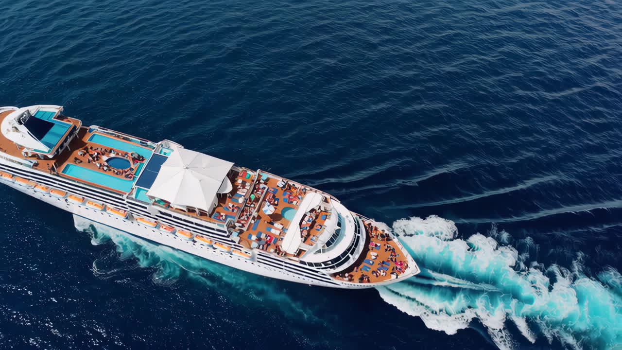 Aerial View of a Cruise Ship Sailing on Blue Waters with Passengers Enjoying the Deck
