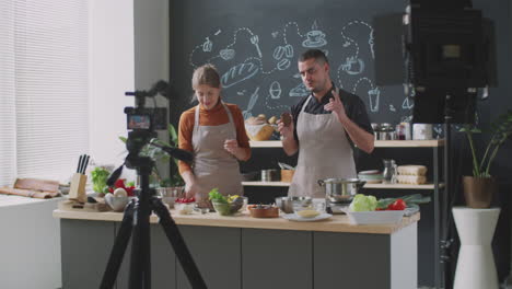 cooking show featuring a couple preparing food