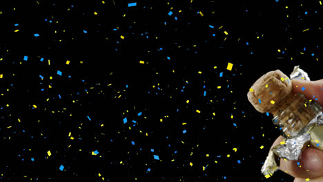 Animation-of-confetti-over-man-opening-champagne-on-black-background