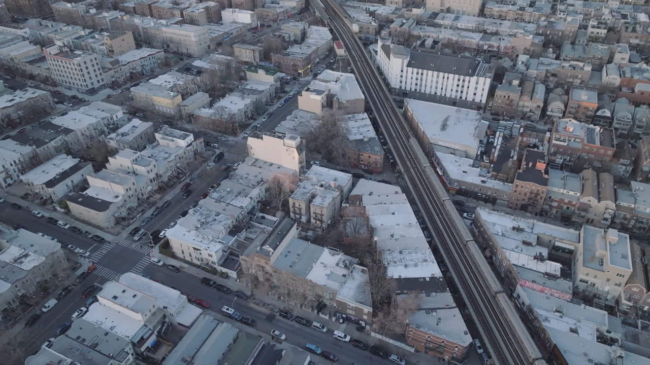 Aerial view of the subway passing through Brooklyn. Shot at dusk.