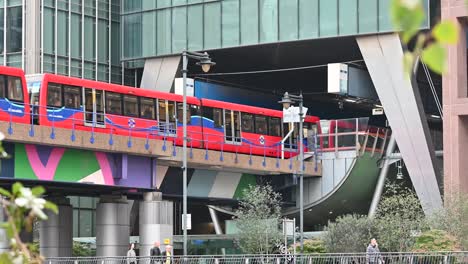 view of the dlr coming over canary wharf, london, united kingdom