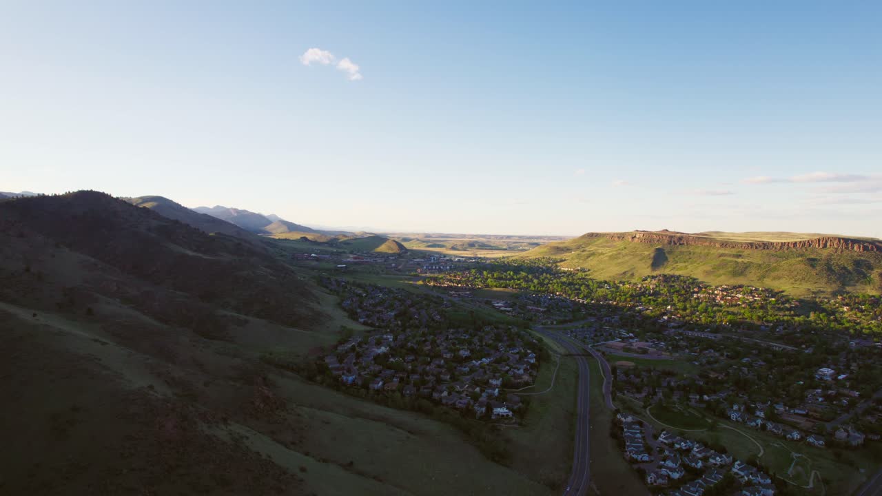 Aerial Drone Footage Of Golden Colorado USA During Golden Hour Sunset. Drone Flying Forward Above Small Town