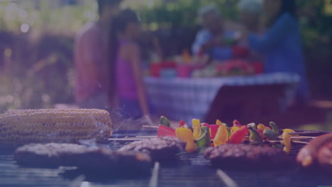 animation of happy biracial family having bbq and talking