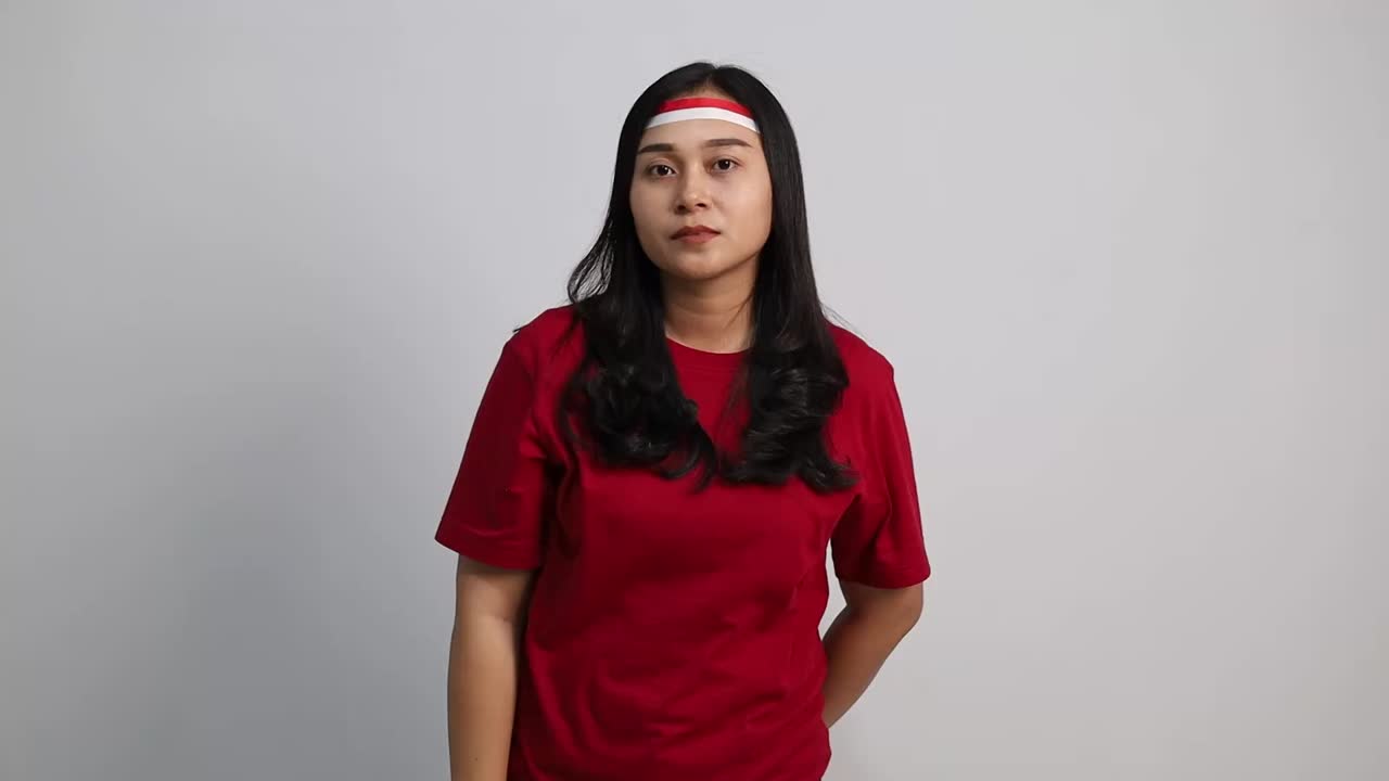 Thoughtful Indonesian woman thinking an idea with Indonesia independence day concept