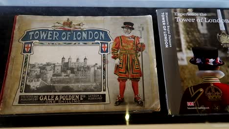 hand-held shot of a historic painting of a london beefeater within the tower of london