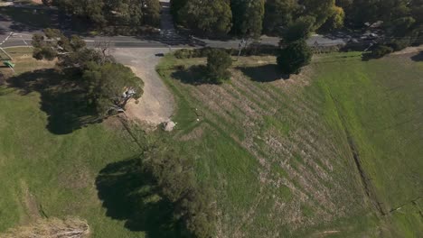 fpv drone footage showing an aerial view of a town surrounded by dense forest