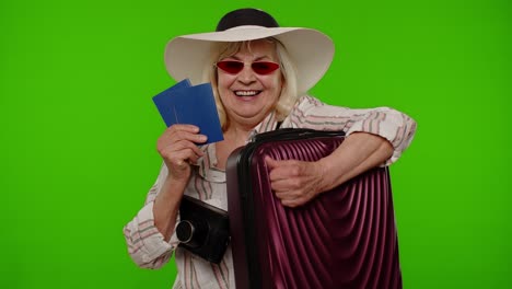 traveler tourist senior woman holding passport tickets dreams of which country go rest on vacation