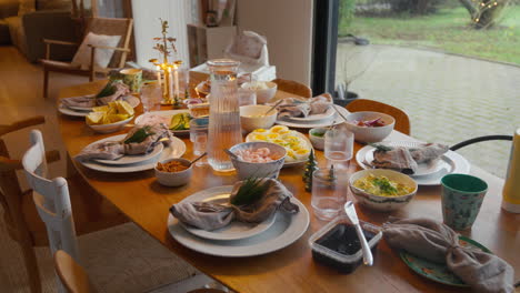 elegant scandinavian-style dining table set for a festive meal