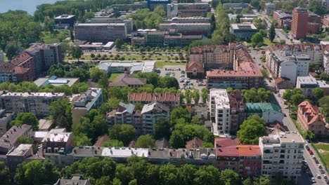 aerial: novi sad city in serbia, 4k view over city streets and buildings